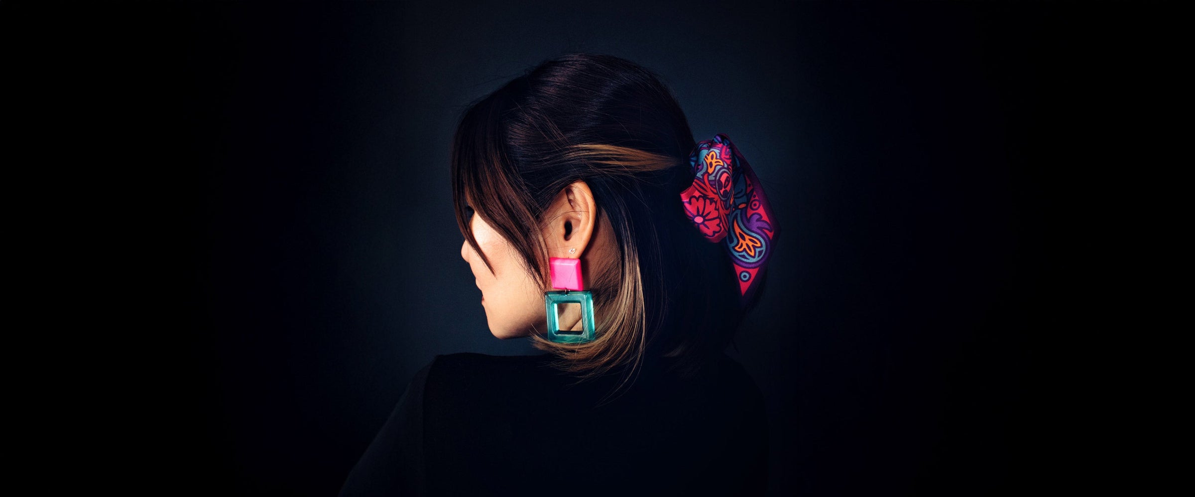 Mini twilly scarf worn in the hair of a beautiful lady