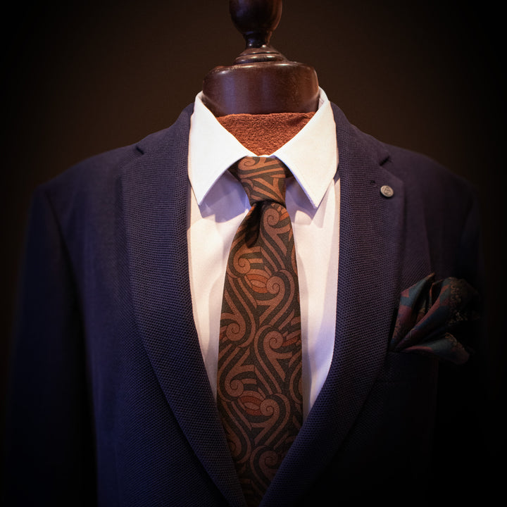 Silk wool tie on a shop mannequin in a blue suit – Luxury accessories