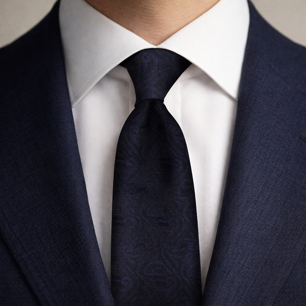Dark black and midnight blue tie with a blue suit