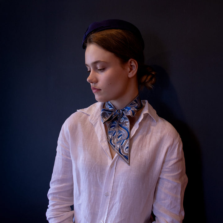 Thames Twilly Ribbon Scarf worn as a bow. Blue silk scarf. Luxury Scarves, made in England | Furious Goose