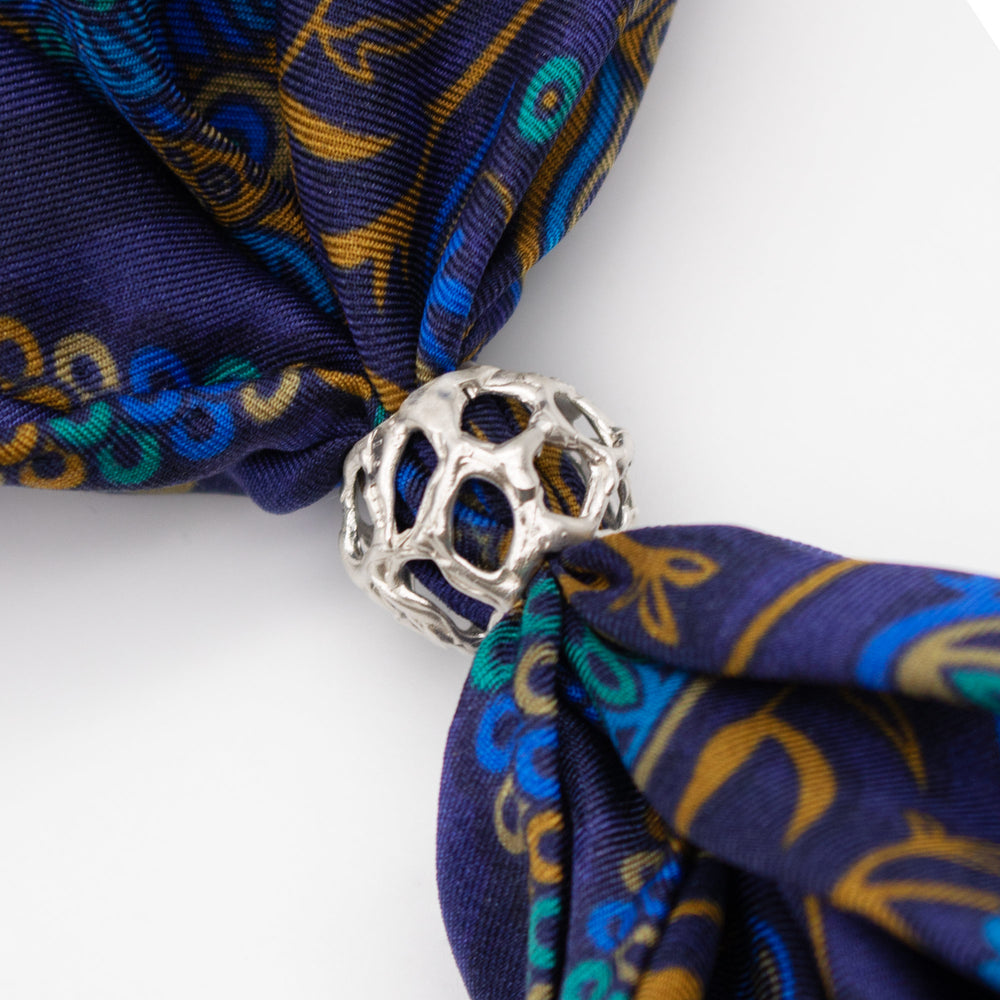 Small scarf ring for pocket squares or smaller twillies. Shown with a blue silk pocket square. Solid silver – Made in London – Furious Goose